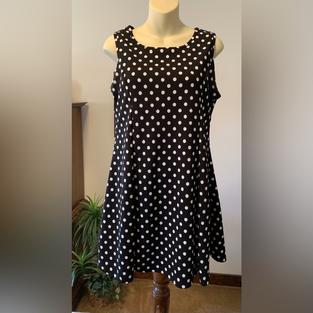 Polyester Black A-line with white poke-a-dots sleeveless dress.